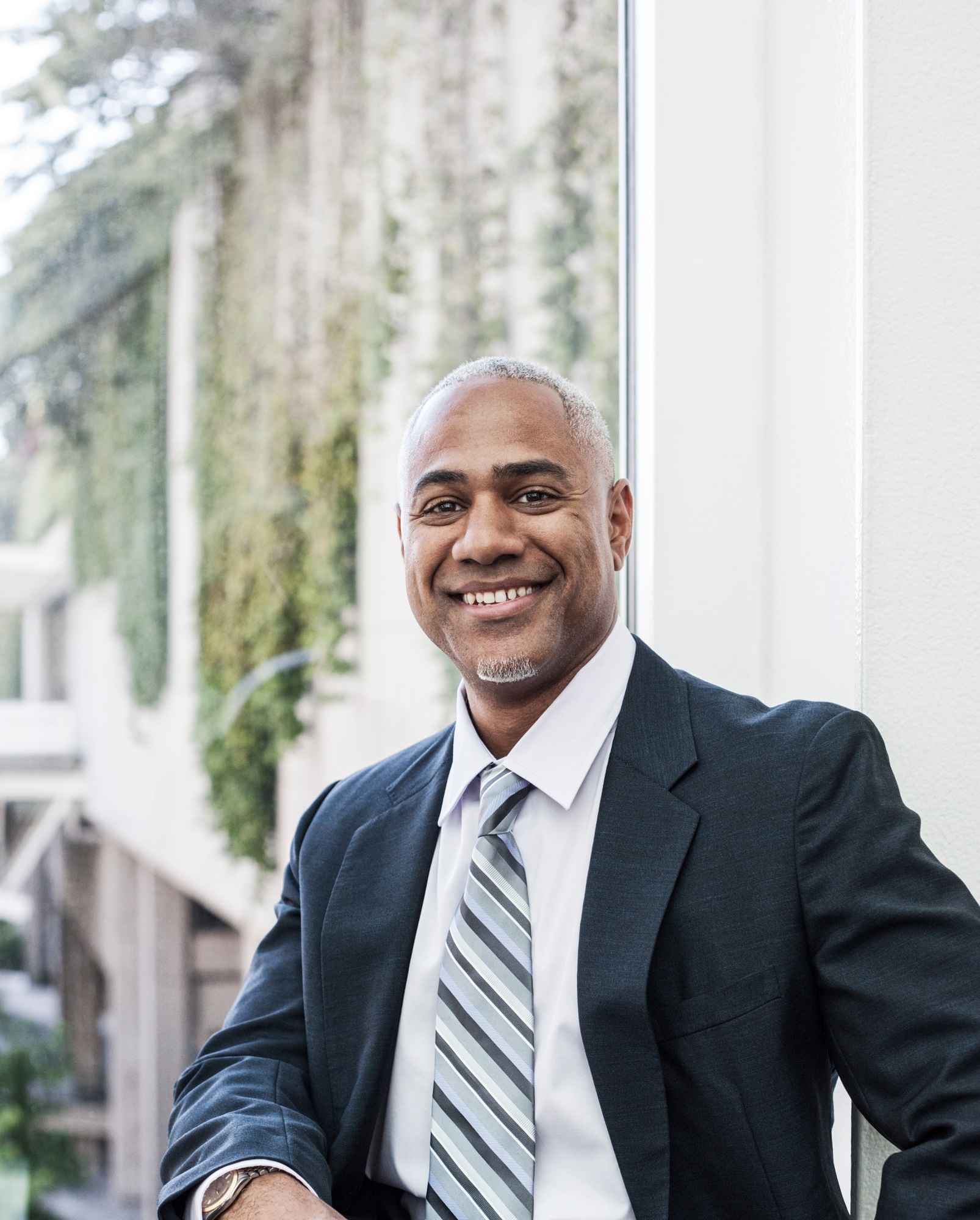 View of a black business man in a shirt and tie.